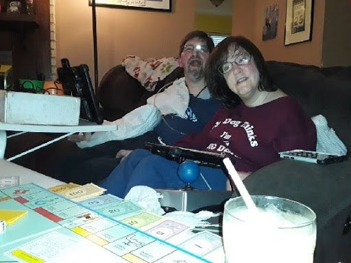 Dave Chapple and his wife playing Monopoly at home