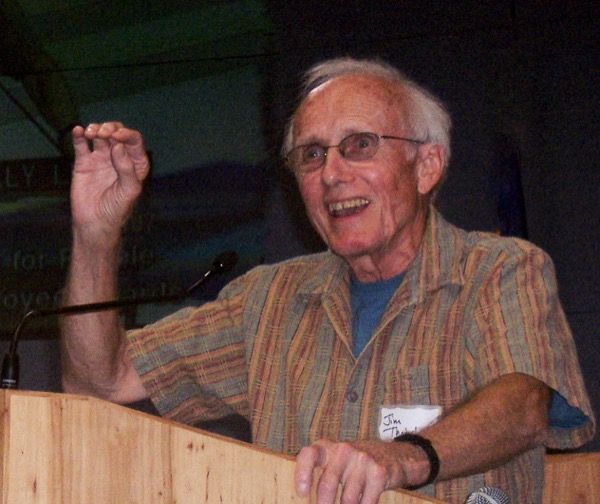 Jim Thatcher standing behind a lectern